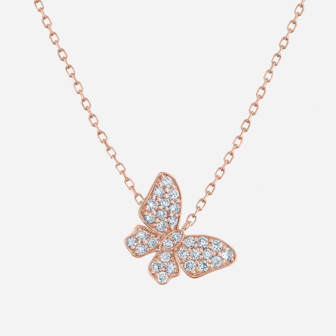 This butterfly necklace contains round natural diamonds. Shown in rose gold.
