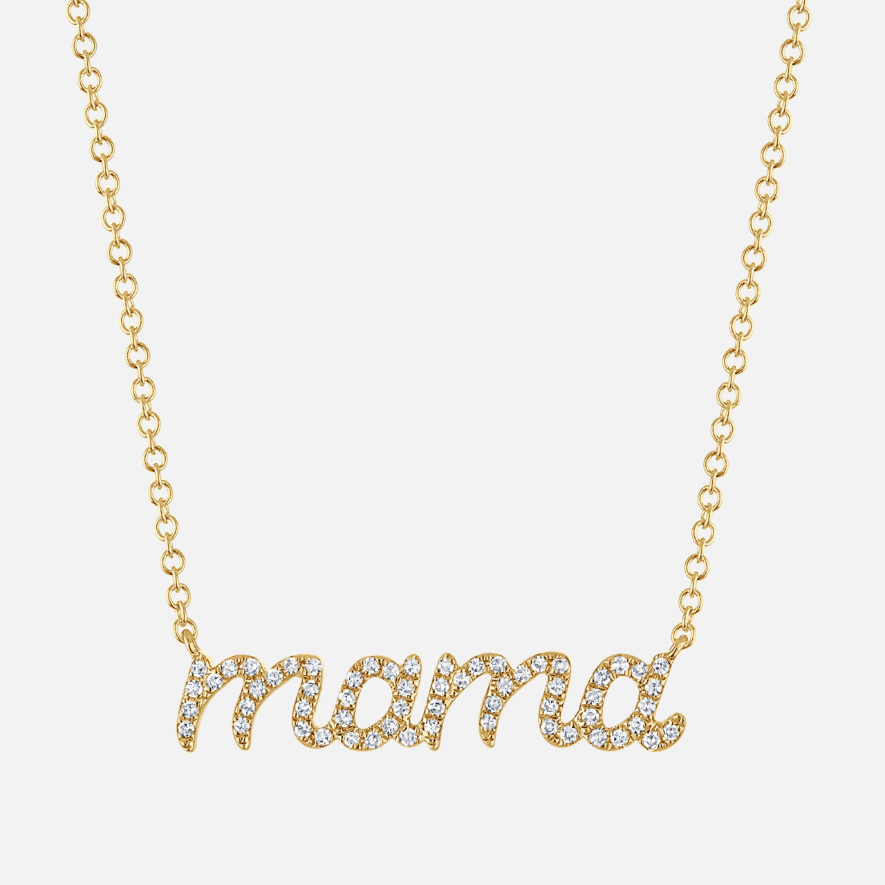 This is a gold "mama" script necklace featuring sparkling pavé diamonds set in cursive lettering on a delicate chain.