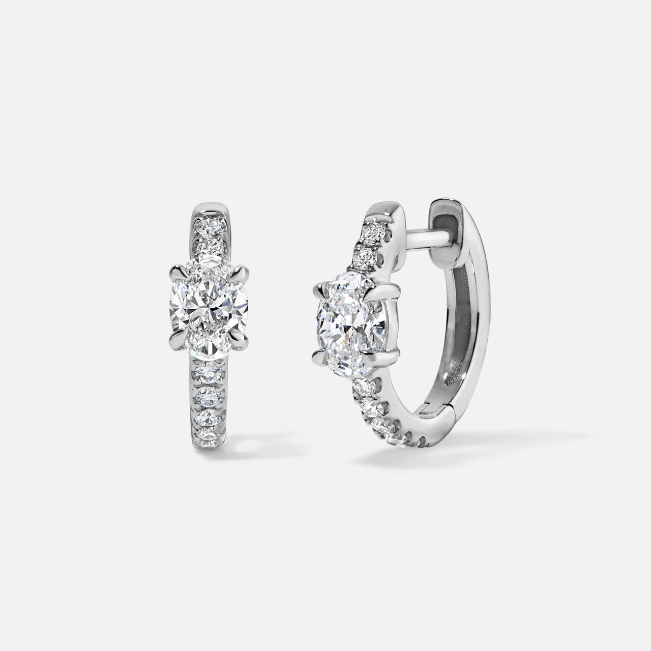 Refined Oval-Diamond Center Huggies in white gold