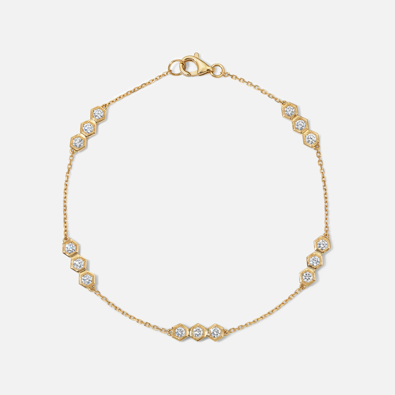 Refined diamond honeycomb station bracelet in yellow gold