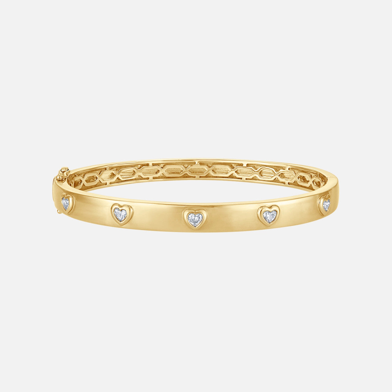 This yellow gold bangle contains heart-shaped diamonds in bezel setting.