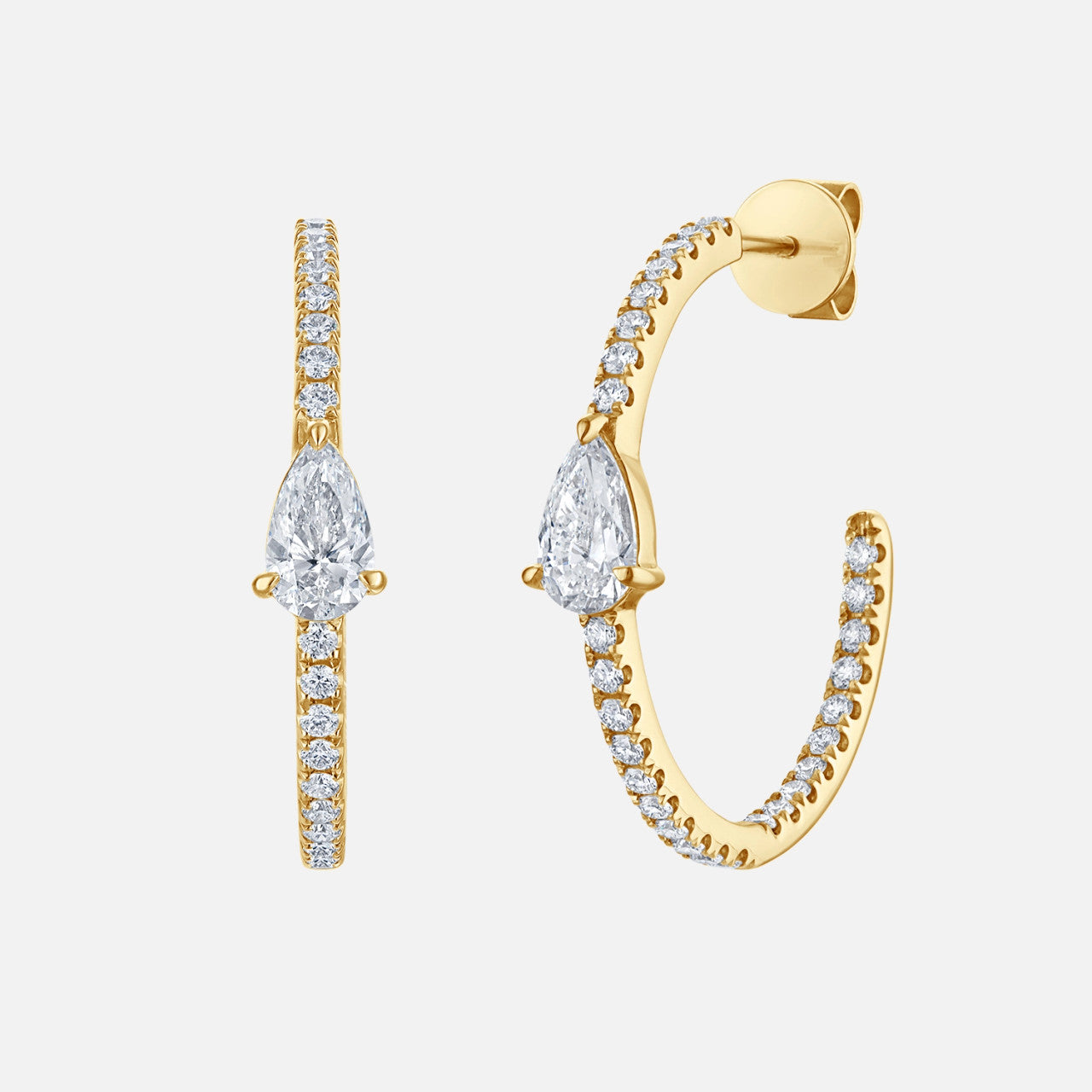 Refined diamond yellow gold hoops with a pear diamond in the center