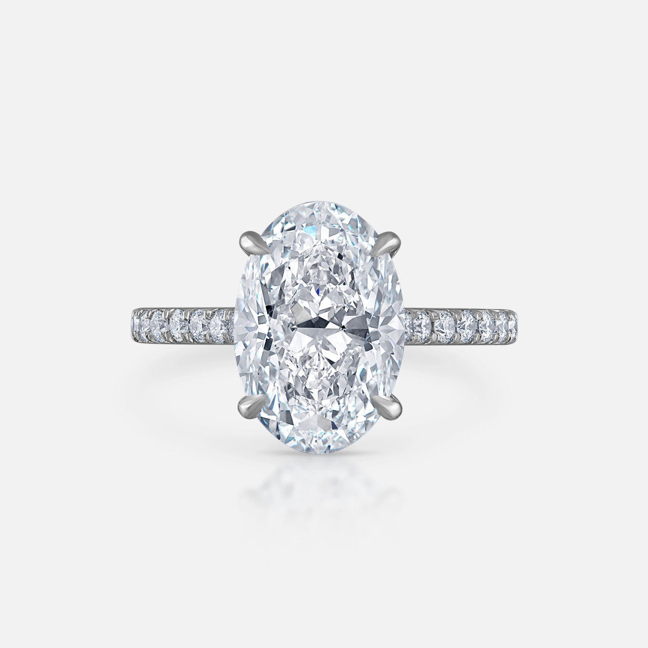 Oval diamond engagement ring in a modern pave setting