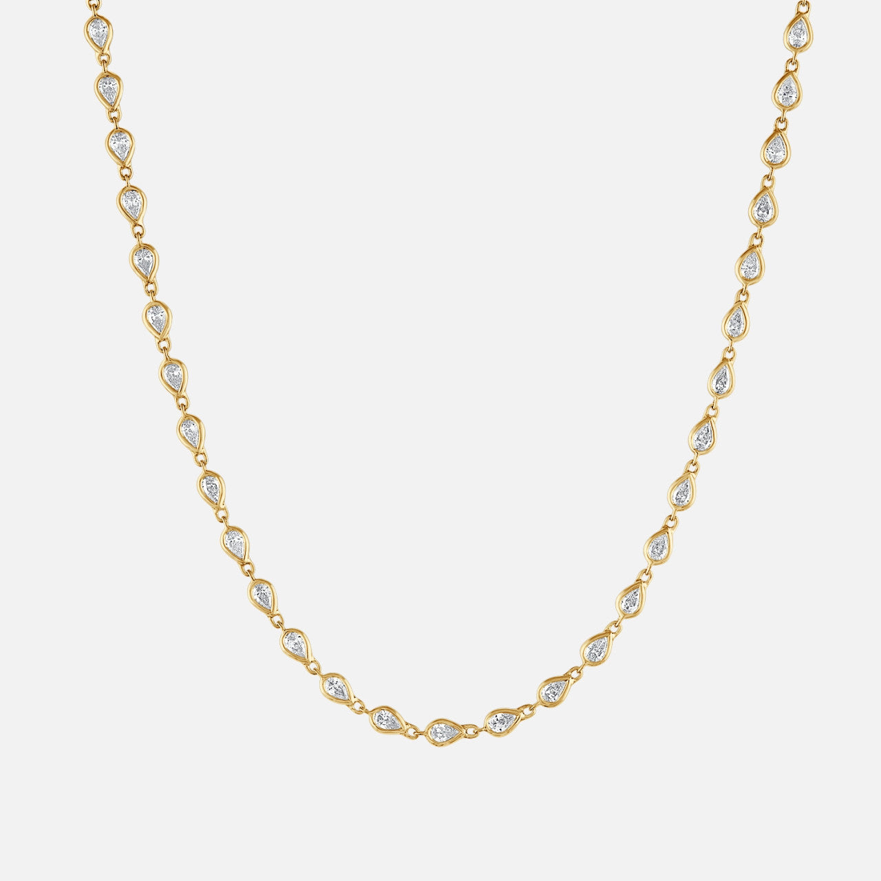 Refined pear shape tennis necklace bezel set in yellow gold