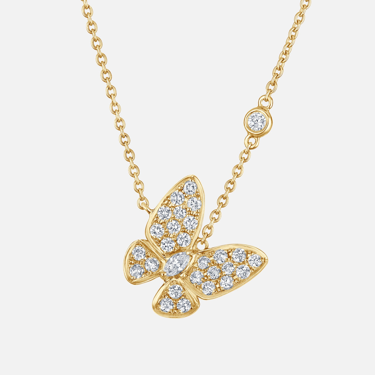 A delicate diamond butterfly flutters along a diamond accented chain. It features 1 marquise and 27 round natural diamonds.