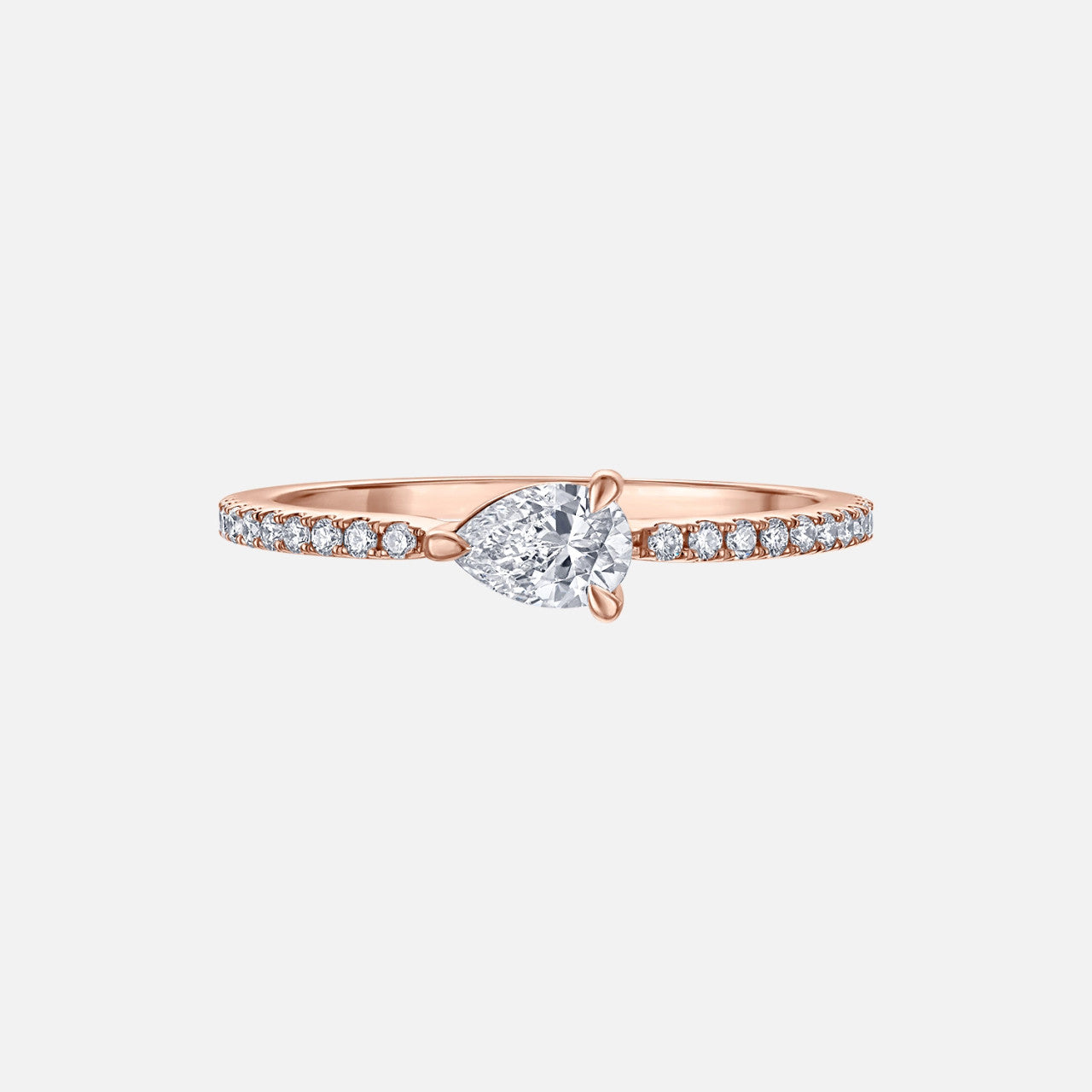 Refined rose gold pave diamond stacking ring with pear shaped diamond center