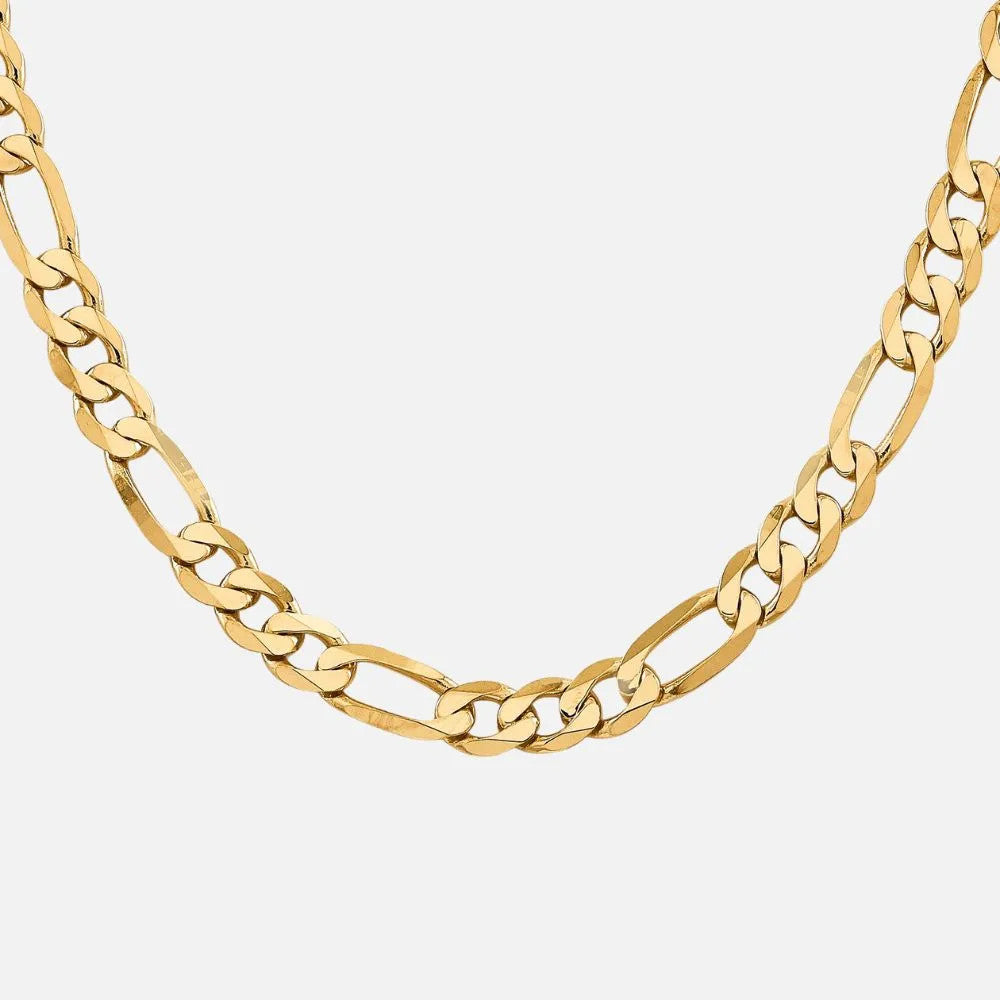 The yellow gold flat Figaro chain features bold 7.5 mm links.