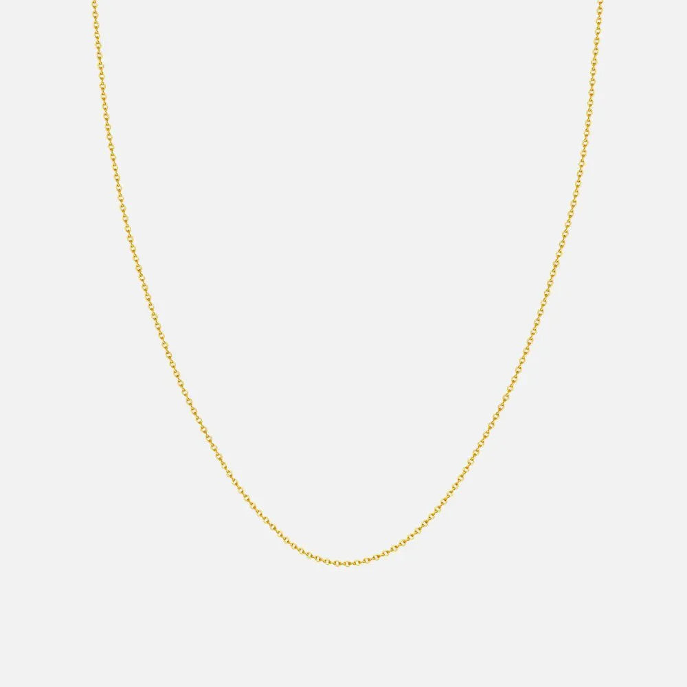 This classic 1.5 mm cable chain is crafted in 14K gold and finished with a secure lobster clasp. Available at Razny Jewelers.
