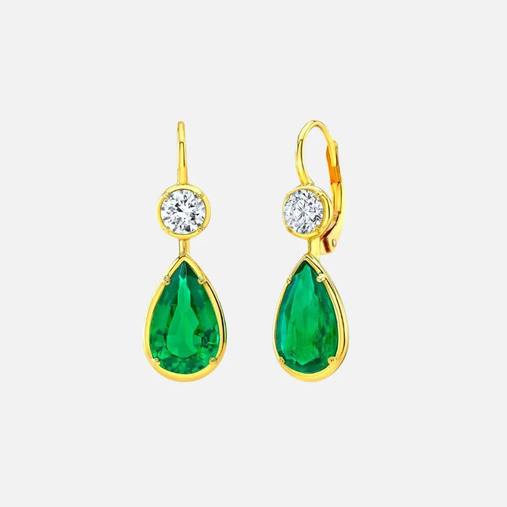 These yellow gold drop earrings showcase round natural diamonds and pear-shaped emeralds.