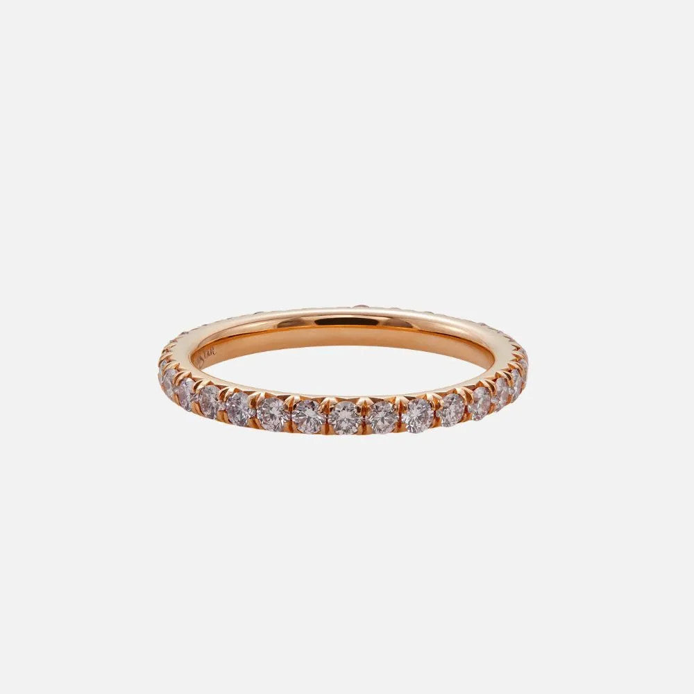 This 18K pink gold eternity band is set with 31 round pink diamonds.