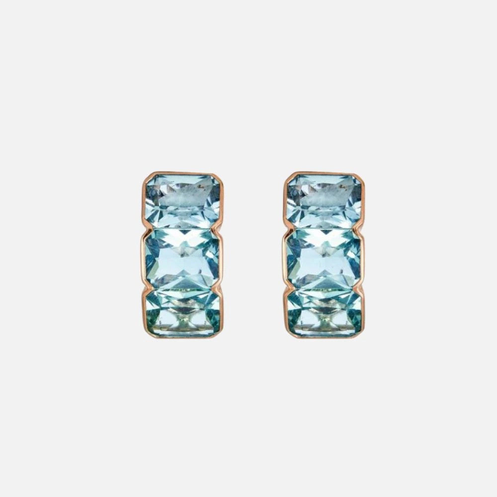 Piranesi blue topaz earrings: These 18k rose gold earrings feature six emerald-cut blue topaz stones in sleek bezel settings.
