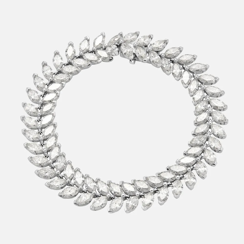 This white gold bracelet features 76 marquise-cut diamonds with a unique arrangement of the marquise stones.
