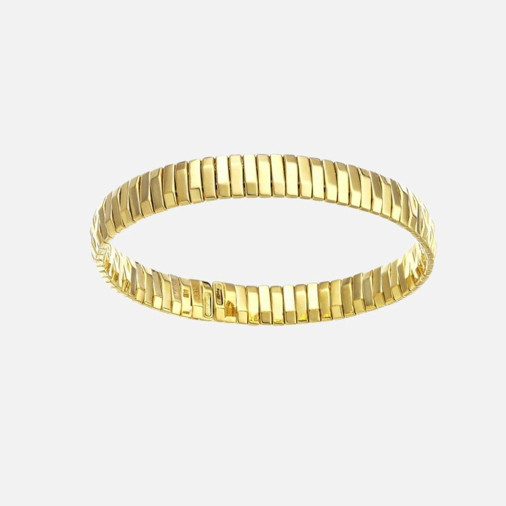 This  Chimento18k yellow gold bangle from the Armillas collection features an inclined mirror bars design that reflects light.
