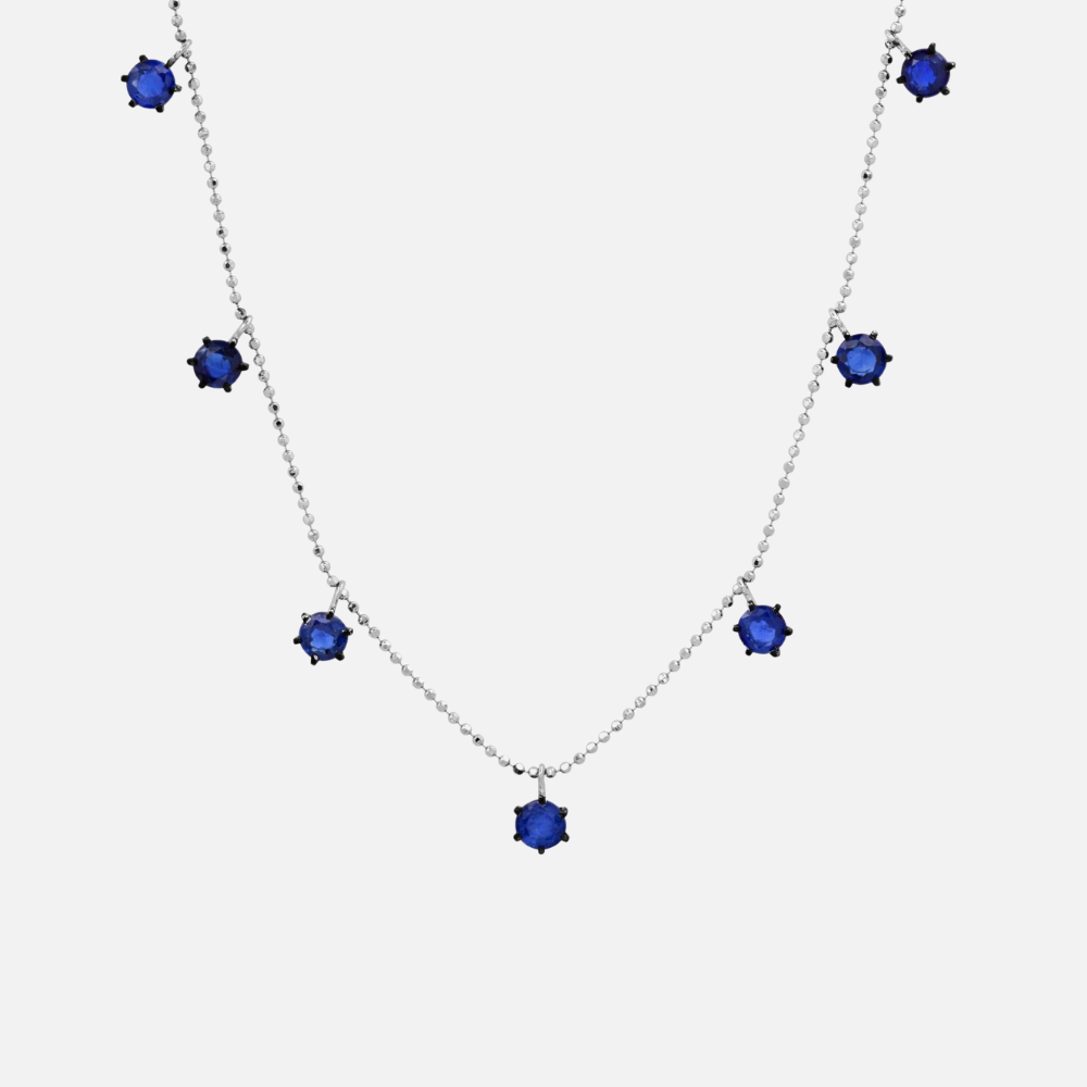 Two carats of blue sapphires float along this 18k white gold adjustable bolo chain necklace.