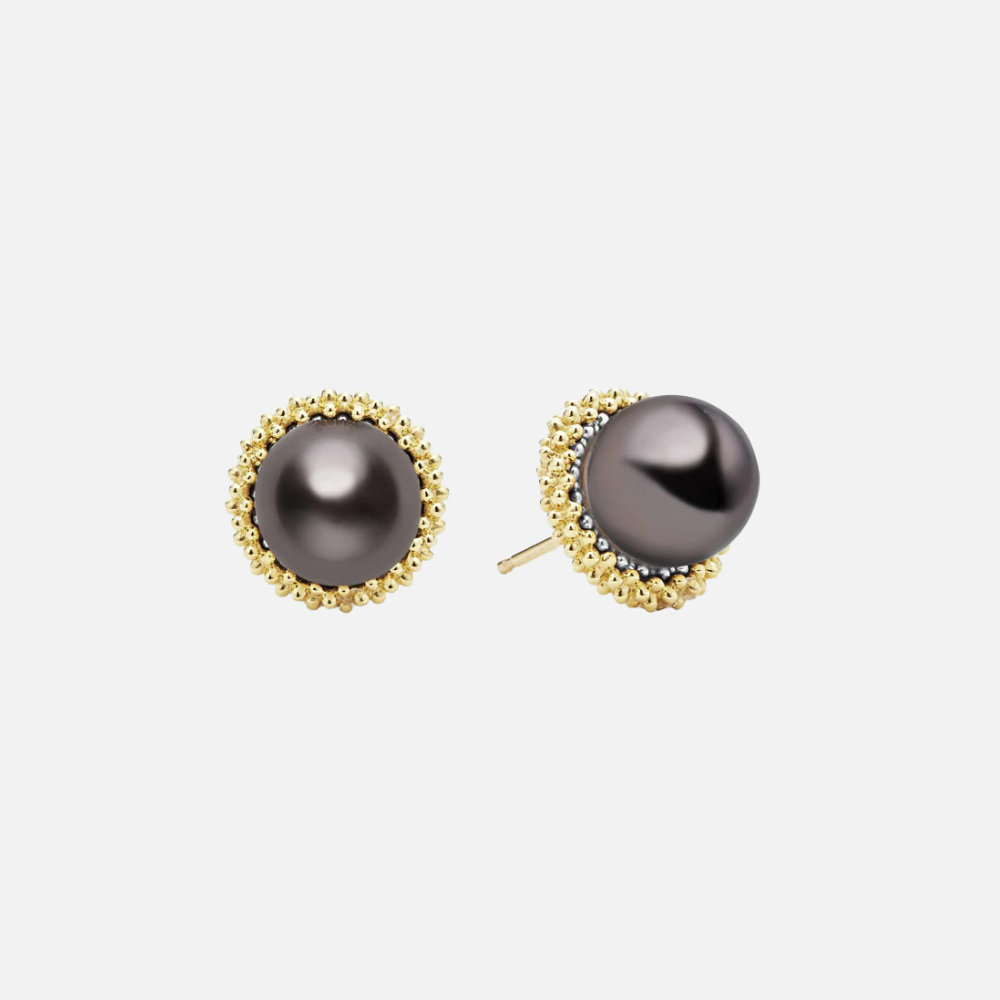 A tahitian black pearl stud earrings set in 18K gold Caviar beading.