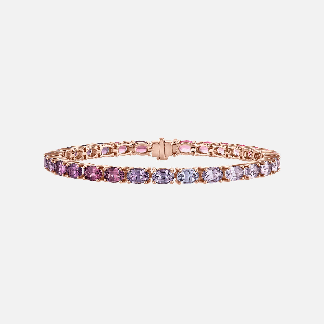 This 18K rose gold 7" bracelet showcases 30 oval ombré spinels totaling 14.51 carats.