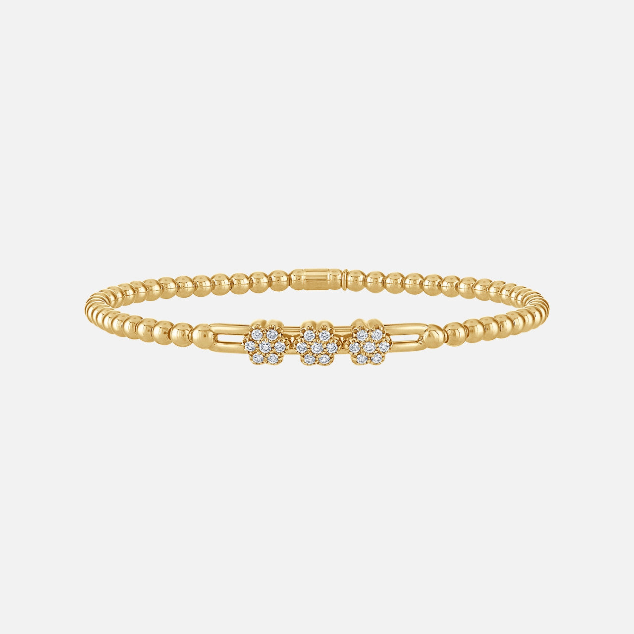 Diamond stretch bracelet with a beaded design and triple flower clusters containing 21 radiant, round natural diamonds in yellow gold.